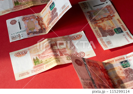 Five thousands russian ruble banknotes with red background 115299114