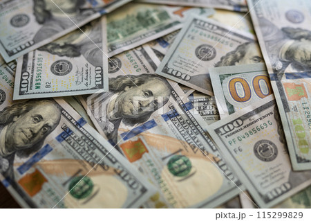 Texture of dollar bills. One hundred dollars. Close-up. 115299829