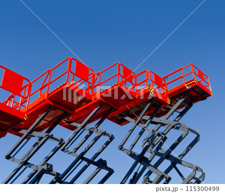 Group of red scissor lifts Group of red scissor lifts 115300499