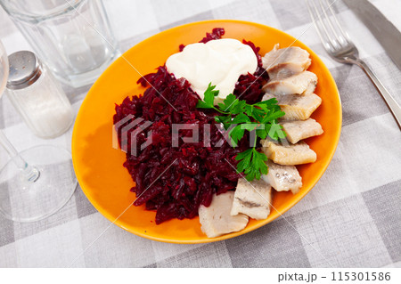 Marinated herring with boiled grated beetroot, mayonnaise and greens Marinated herring with boiled grated beetroot, mayonnaise and greens 115301586