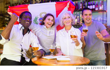Happy fans celebrating the victory of Peruvian team in bar 115301917