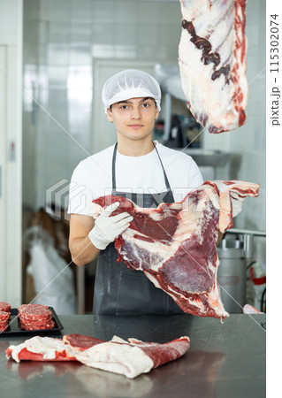 man behind counter prepares man behind counter prepares 115302074