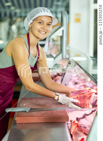 woman behind counter showcases woman behind counter showcases 115303258