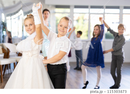 Children dance in pairs at festive matinee 115303873