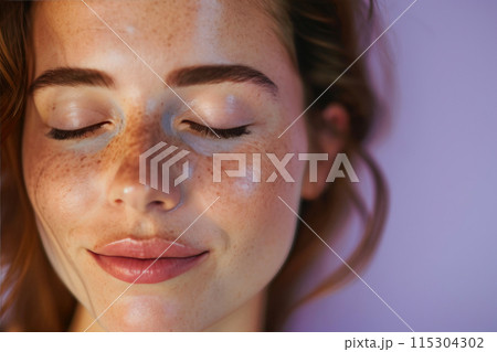 Serene Beauty: Woman Embracing Cosmetic Bliss 115304302
