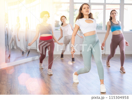 Group of women dancing dancehall in studio Group of women dancing dancehall in studio 115304958