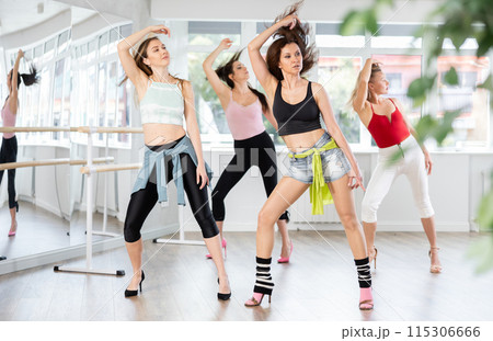 Group of women dancing high heels in studio Group of women dancing high heels in studio 115306666