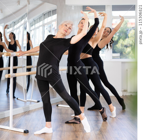 Girls in ballet class perform Batman with participation of mature female mentor 115306821