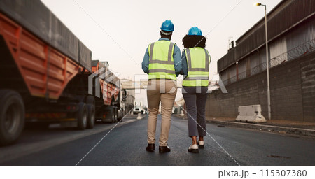 Construction worker, team and walking with discussion at logistics site in morning for vehicle inspection or cargo export. Shipping industry, inspectors and outdoor with back for quality assurance 115307380