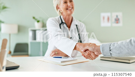 Happy woman, doctor and handshake with patient for consultation, agreement or checkup at hospital. Female person or medical professional shaking hands with client for meeting, deal or appointment 115307540
