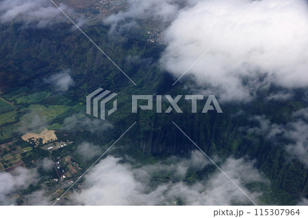 Aerial view of clouds over Waimanalo Farm lands, koolau mountains, and ridge communities of Honolulu 115307964