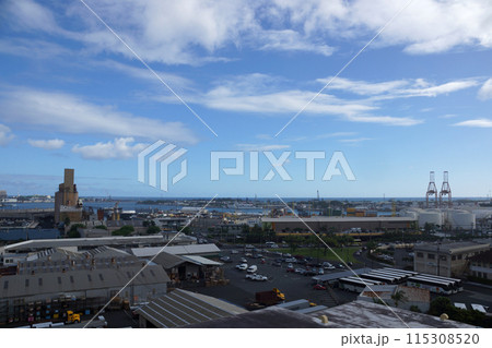 Aerial view of the Honolulu Port with landmarks Nimitz Highway, cargo cranes and Sand Island Aerial view of the Honolulu Port with landmarks Nimitz Highway, cargo cranes and Sand Island 115308520