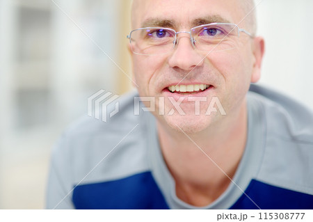 Portrait of rehab doctor is on appointment of patient in gym. PMR specialized in physically-based rehabilitation and recovery. This treat using exercises and orthopedics. 115308777