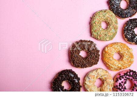 Various delicious donuts with different sprinkled decorations 115310672
