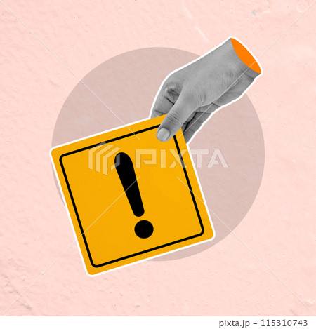 Hand holding exclamation mark sign against pink background 115310743