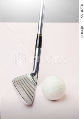 Closeup view of a golf ball with a golf club Closeup view of a golf ball with a golf club 115310776