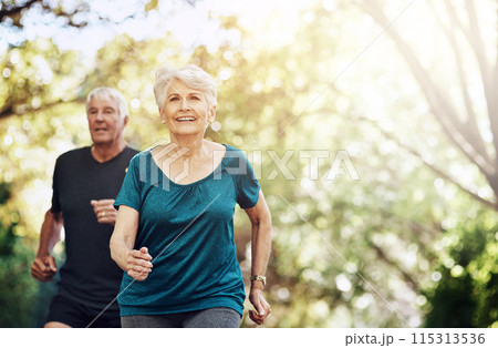 Running, outdoor and old couple with sunshine, smile and wellness with challenge, healthy and hobby. Park, senior man and mature woman with training, retirement and exercise with fitness and cardio 115313536