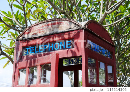 Wooden vintage public telephone booth on outdoor street in Thailand Wooden vintage public telephone booth on outdoor street in Thailand 115314303
