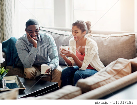 Couple, relax and coffee on sofa in morning for conversation or talking in living room. Man, woman and discussion at home chat, happy and married with tea for day plan or romantic date in summer Couple, relax and coffee on sofa in morning for conversation or talking in living room. Man, woman and discussion at home chat, happy and married with tea for day plan or romantic date in summer 115317185