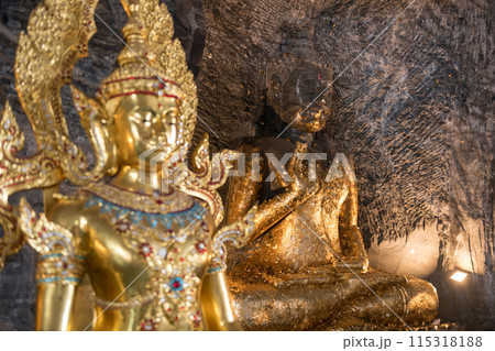 Ancient stone Buddha statue and gold god inside Suphan buri cave Ancient stone Buddha statue and gold god inside Suphan buri cave 115318188