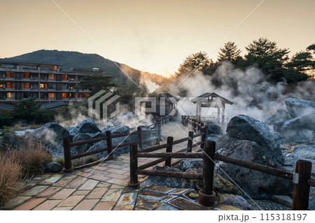 Mount Unzen Hell valley Jigoku and hotel with sulfur gas at sunset 115318197