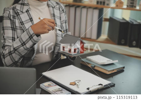 buy or sell real estate mortgage, Sale representative offer house purchase contract to buy a house or apartment and mortgage Money and Financial Concepts 115319113