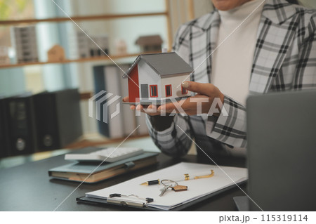 buy or sell real estate mortgage, Sale representative offer house purchase contract to buy a house or apartment and mortgage Money and Financial Concepts 115319114