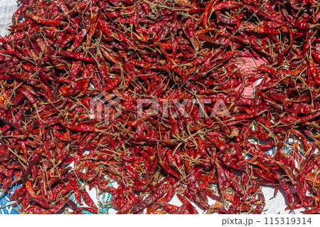 Close up dried chilli background. Red hot chili wallpaper Close up dried chilli background. Red hot chili wallpaper 115319314