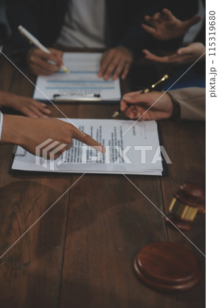Judge gavel with Justice lawyers having team meeting at law firm background. Concepts of Law and Legal services. Judge gavel with Justice lawyers having team meeting at law firm background. Concepts of Law and Legal services. 115319680