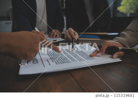 Judge gavel with Justice lawyers having team meeting at law firm background. Concepts of Law and Legal services. 115319681