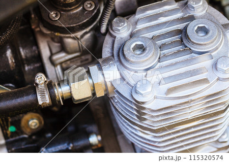 Detailed closeup of alternator generator machine engine Detailed closeup of alternator generator machine engine 115320574