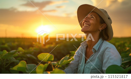 Radiant Woman Farmer Gazing Skyward in Soybean Fields 115321817