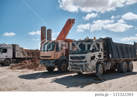 Parked tipper trucks 115322365