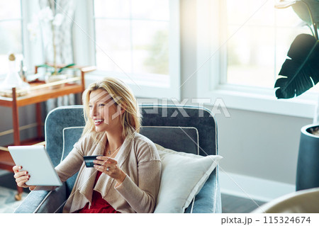 Woman, credit card and tablet or happy lounge, fintech and online transaction for shopping in house. Customer, internet payment and sale or banking app, ecommerce and relax for purchase on chair 115324674