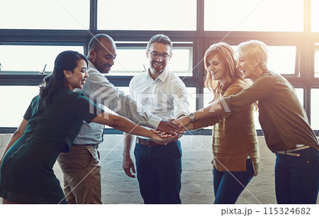 Business people, team and hands with huddle in office for collaboration with synergy, happiness and diversity. Celebrating, victory and goal success in company with workforce, partnership and growth. 115324682