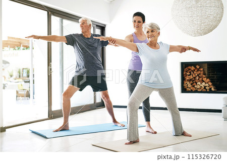 Yoga, senior people and instructor for help, stretching arms or wellness in home. Health care, elderly man or old woman with yogi teacher for exercise, balance or wellbeing with pilates class 115326720