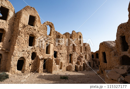 Uninhabited fortified village with houses and granaries, Tunisia. Ksar of Mgabla, Berber, Tataouine. Uninhabited fortified village with houses and granaries, Tunisia. Ksar of Mgabla, Berber, Tataouine. 115327177