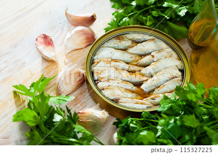 Tin can with smoked sprats, sardines 115327225