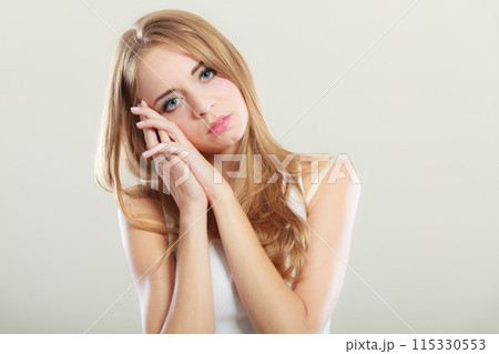 Young sad stressed woman closeup 115330553