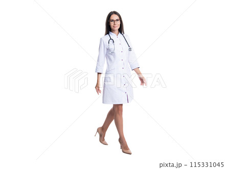 photo of walking cardiologist woman wear white coat. cardiologist woman doctor with stethoscope. photo of walking cardiologist woman wear white coat. cardiologist woman doctor with stethoscope. 115331045