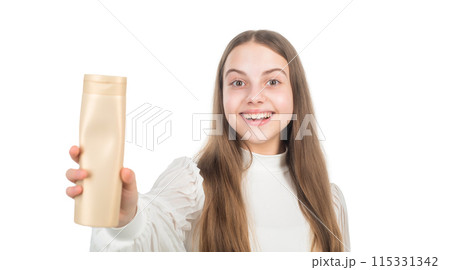 happy kid presenting shampoo or hair body conditioner bottle isolated on white, beauty happy kid presenting shampoo or hair body conditioner bottle isolated on white, beauty 115331342