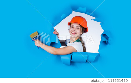 paint wall in color. Decoration, renovation and reconstruction concept. Future profession. color your life. teenager kid. 1 may is labor day. small painter hold paint brush. she loves painting 115331450