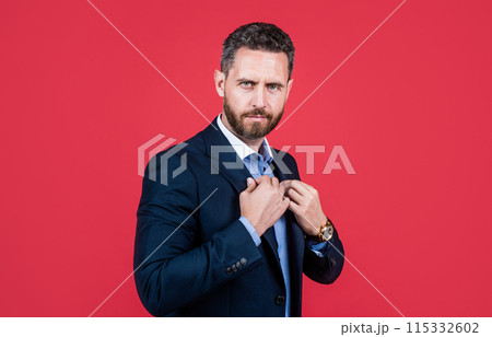 handsome confident businessman in formal suit, charisma 115332602
