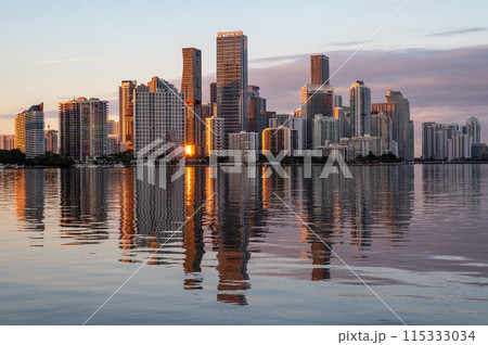 City of Miami, Florida skyline at sunset reflected in calm Biscayne Bay. 115333034