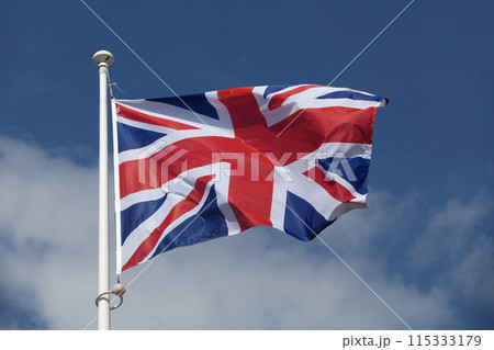 The flag of the United Kingdom waving in mid air The flag of the United Kingdom waving in mid air 115333179