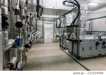 Interior industrial gas boiler with a lot of piping, pumps and valves 115334406
