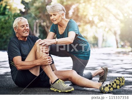 Outdoor, old couple and knee pain with injury, fitness and ache with inflammation, medical condition and support. Accident, exercise and senior man with mature woman, workout and broken with bruise 115337358