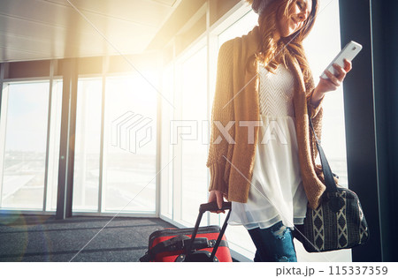 Airport, luggage and woman with smartphone, typing and social media with getaway trip, vacation and sunshine. Person, human or girl with cellphone, lens flare and connection with holiday or departure 115337359