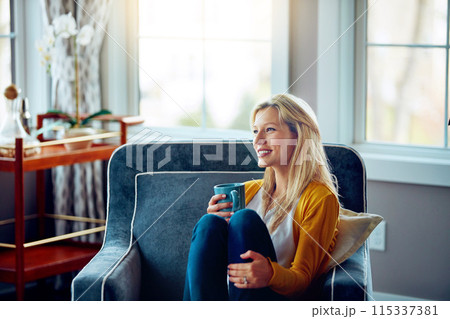 Home, thinking and woman with coffee, chill and remember in weekend, peace and sofa in living room. House, couch and person with tea, daydreaming and happy for drink in lounge and smile in morning Home, thinking and woman with coffee, chill and remember in weekend, peace and sofa in living room. House, couch and person with tea, daydreaming and happy for drink in lounge and smile in morning 115337381