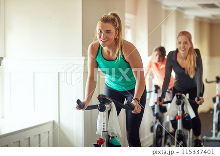 Woman, exercise bike and gym for performance, training and cycling for fitness or spin class. Female person, riding and stationary machine for workout challenge, aerobic instructor and equipment Woman, exercise bike and gym for performance, training and cycling for fitness or spin class. Female person, riding and stationary machine for workout challenge, aerobic instructor and equipment 115337401